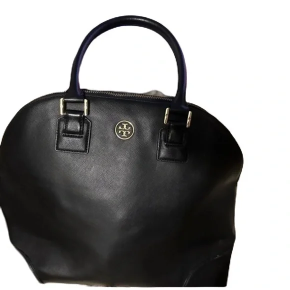 Tory Burch used handbag. About 15” wide and 13 “ tall. This bag is not new.